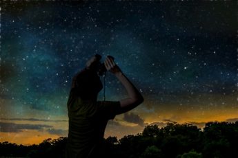 Photo showing stargazing with binoculars.