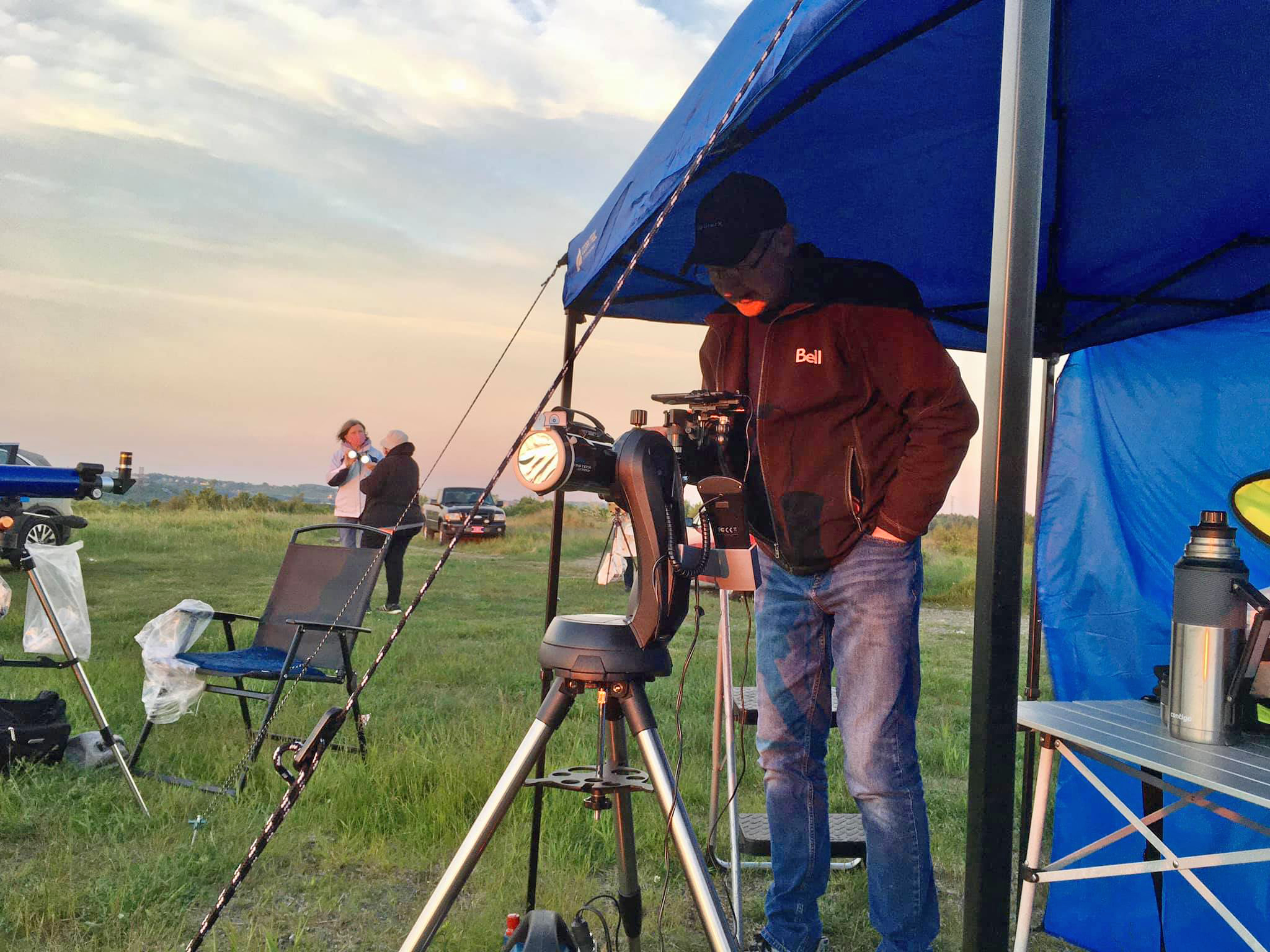 Chris Curwin of the Saint John Astronomy Club and Astronomy by the Bay doing a live feed on FB and YouTube of the Solar Eclipse at sunrise on June 10, 2021.
